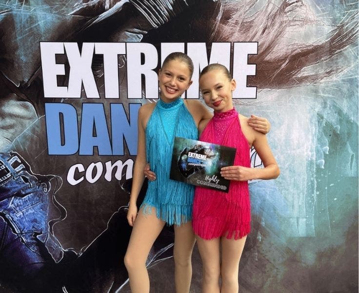 Phot of two students from our senior dance ensemble at the Extreme Dance Competition.