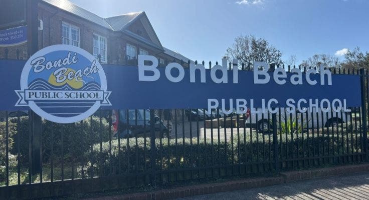 Photo of school sign and logo.