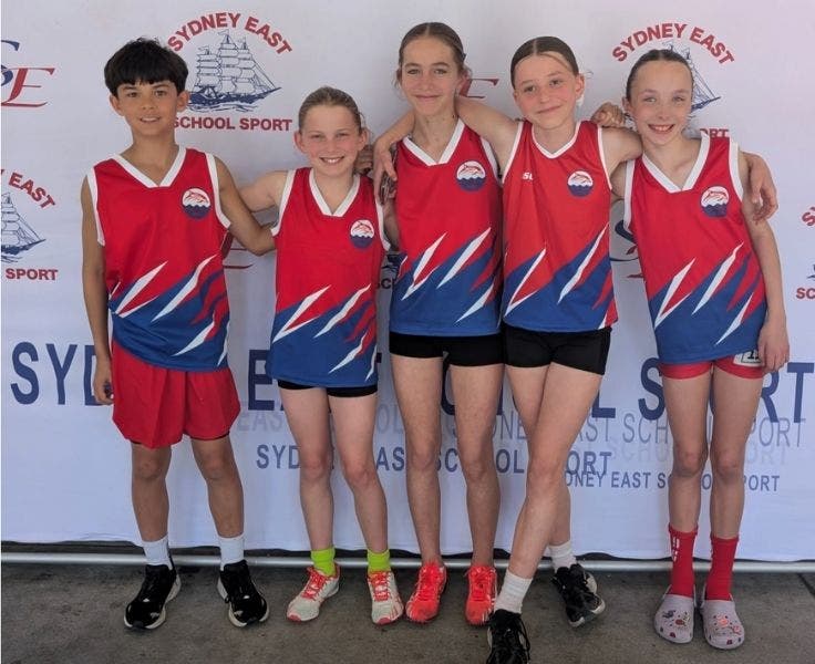 Photo of five students attending the Sydney East athletics carnival.