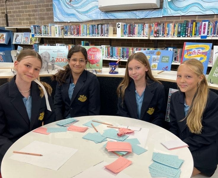Photo of four students on the debating team.